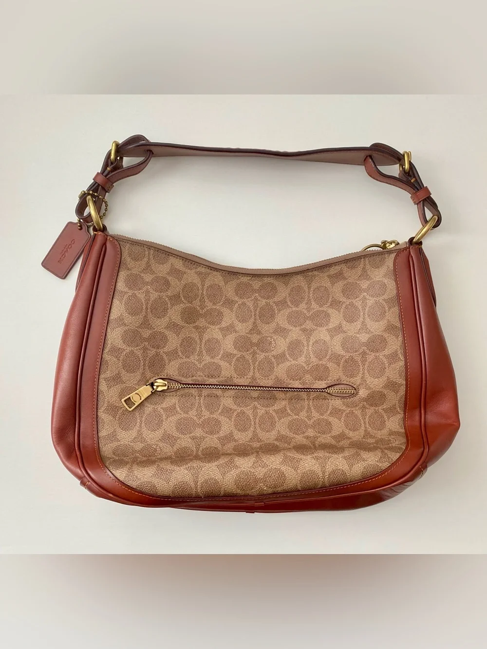 Coach features signature