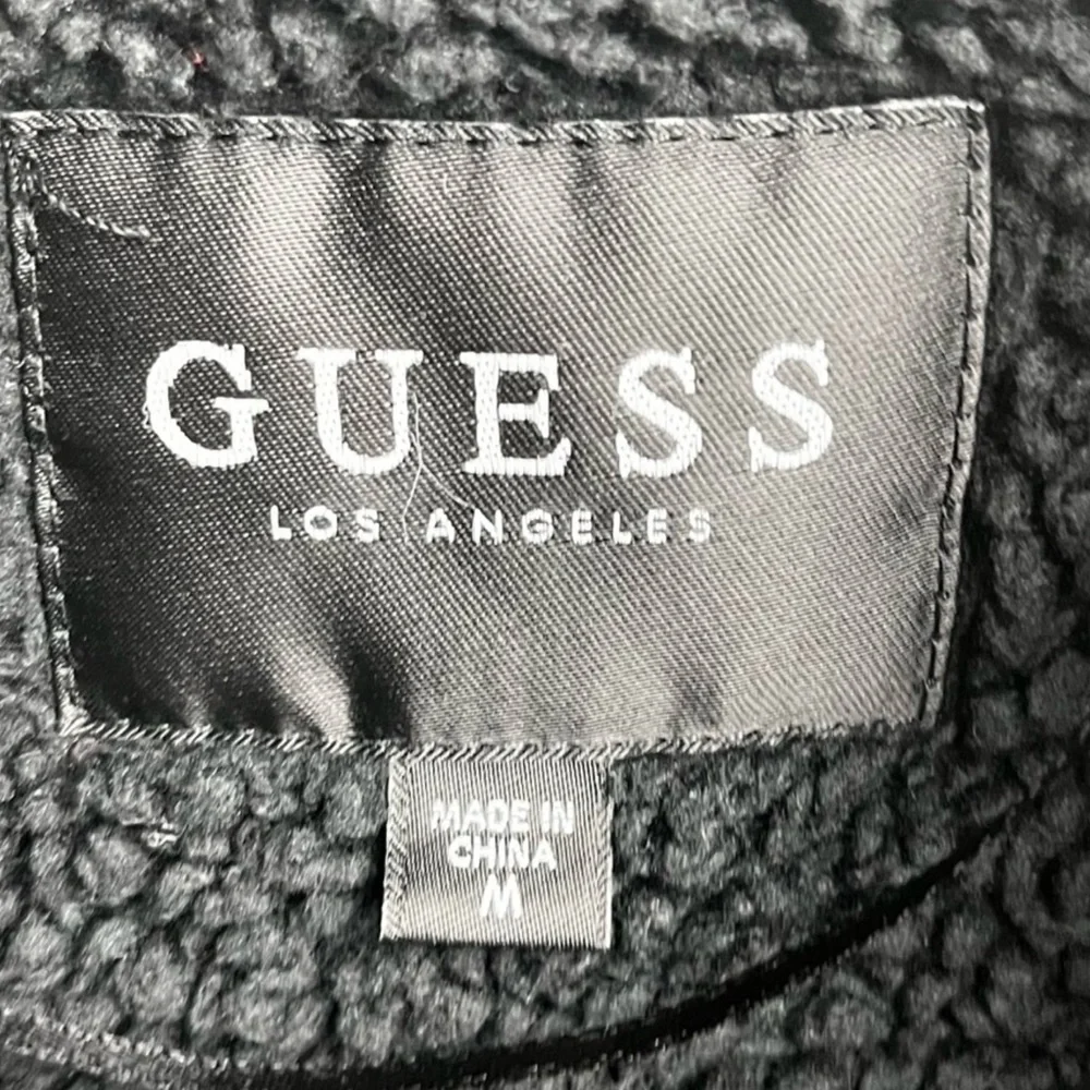 Guess asymmetrical zipper