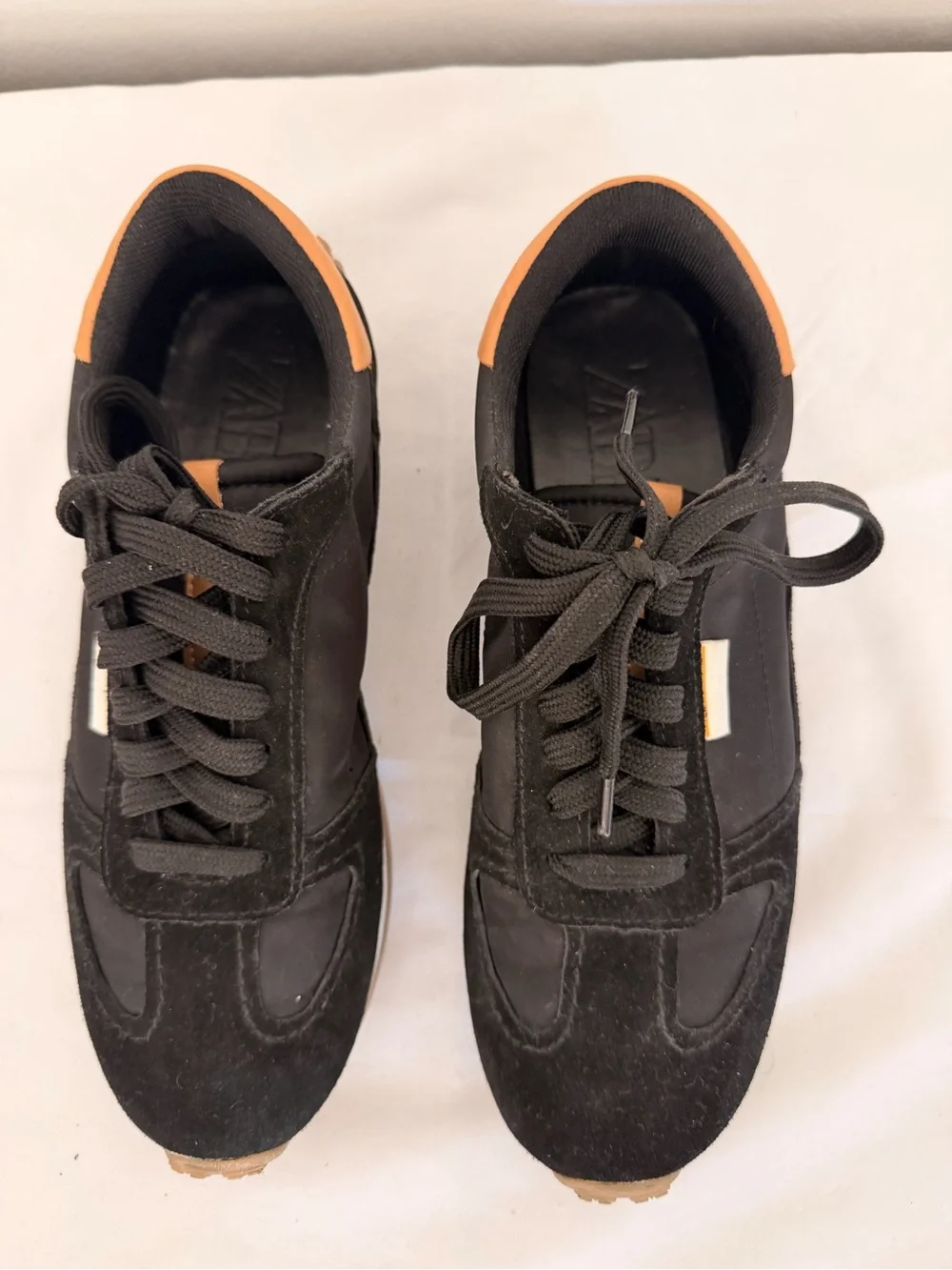 Zara Black Sneakers with Tan Heel Trim