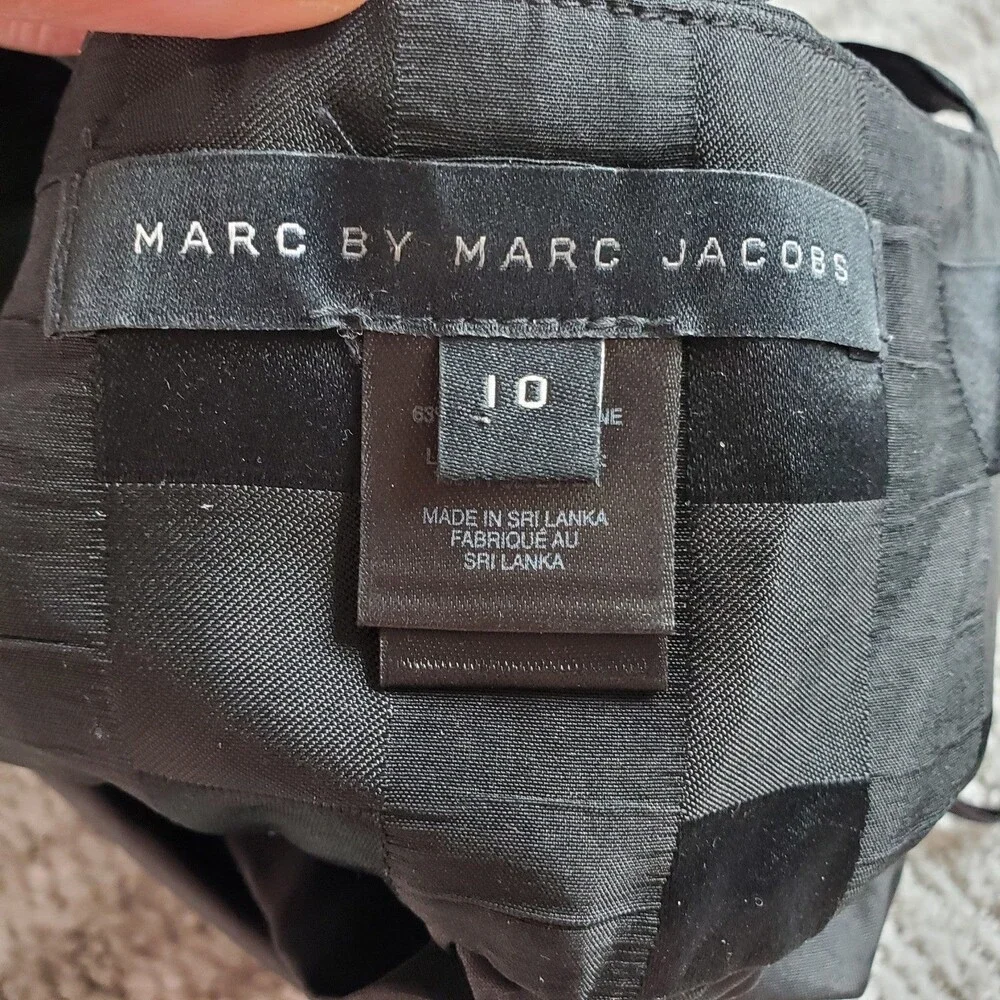 Marc By Marc Jacobs weighs 5oz