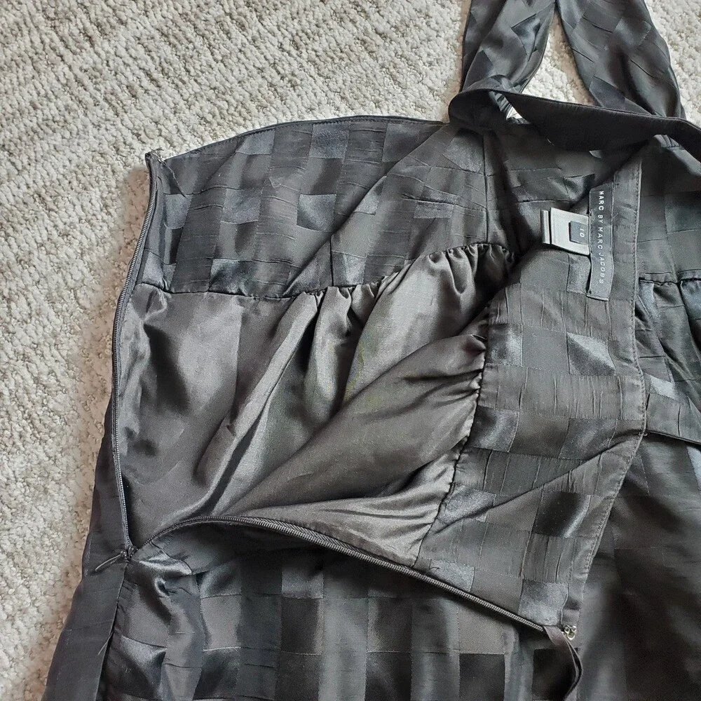 Marc By Marc Jacobs weighs 5oz