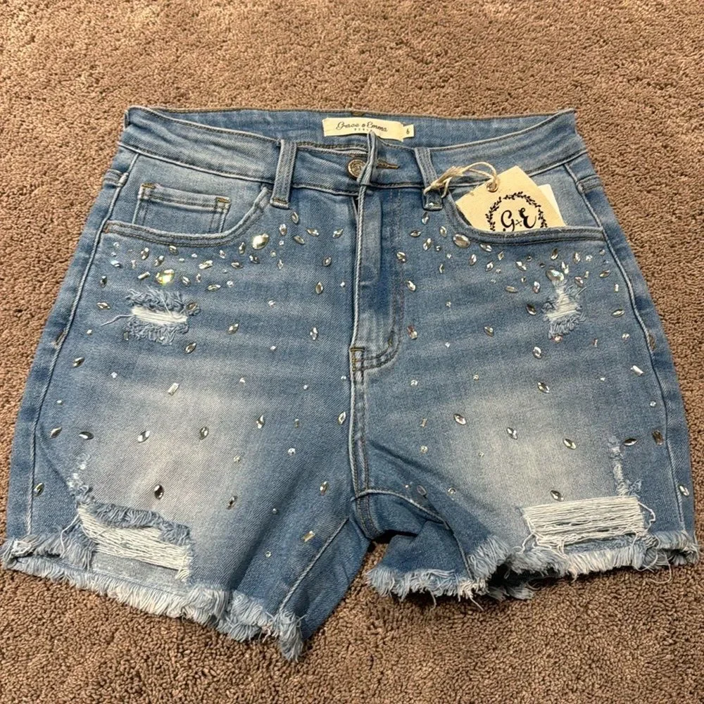 Denim jeweled shorts! With distressing and fray ! Size 6 with some stretch