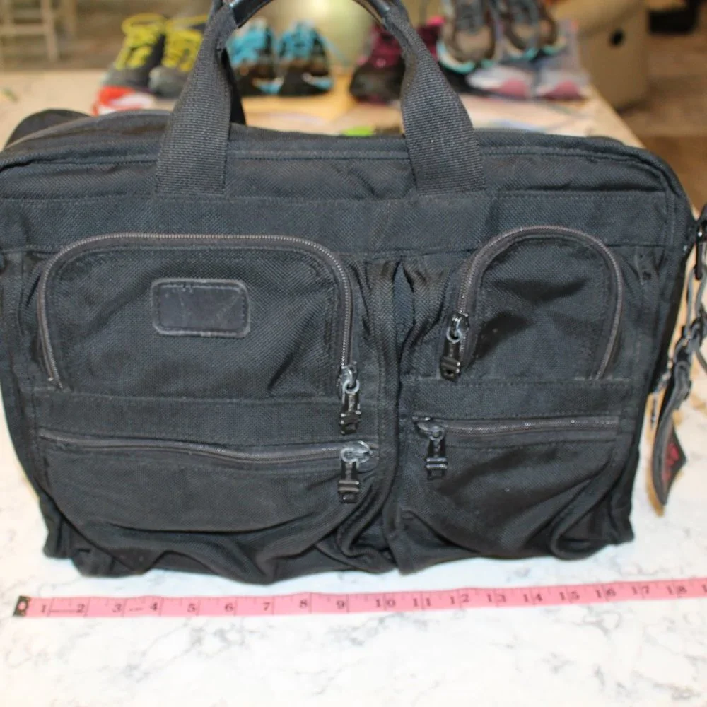 Tumi owned wear strap