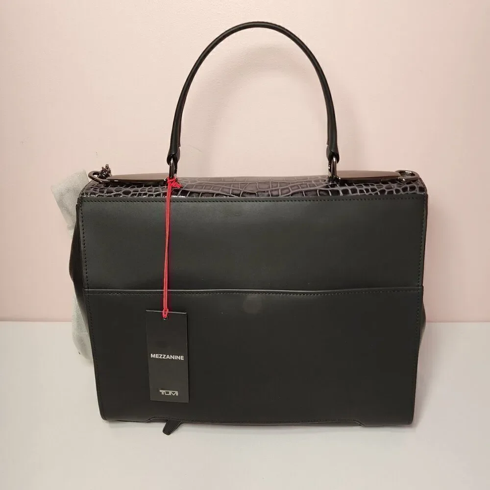 Tumi charm $1 strap