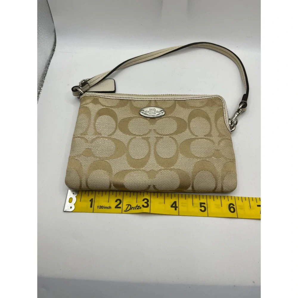 Coach leather wristlet dangling