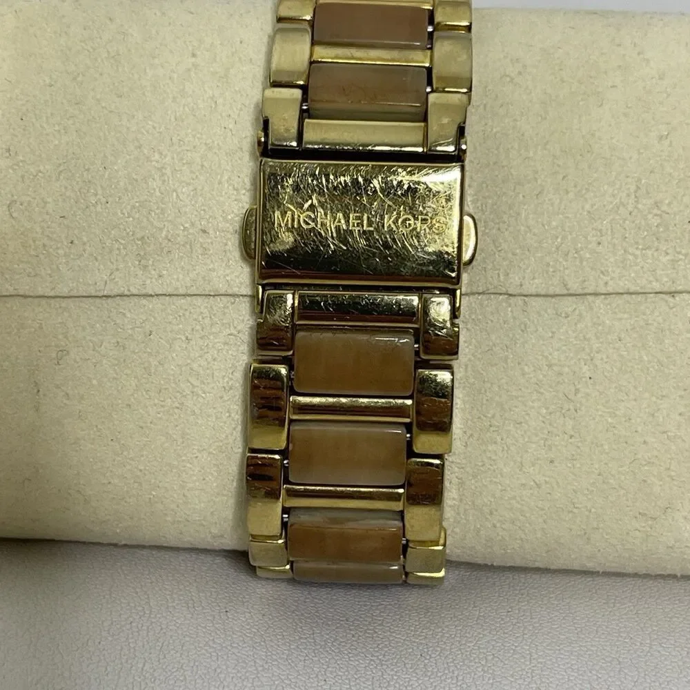 Michael Kors position but size