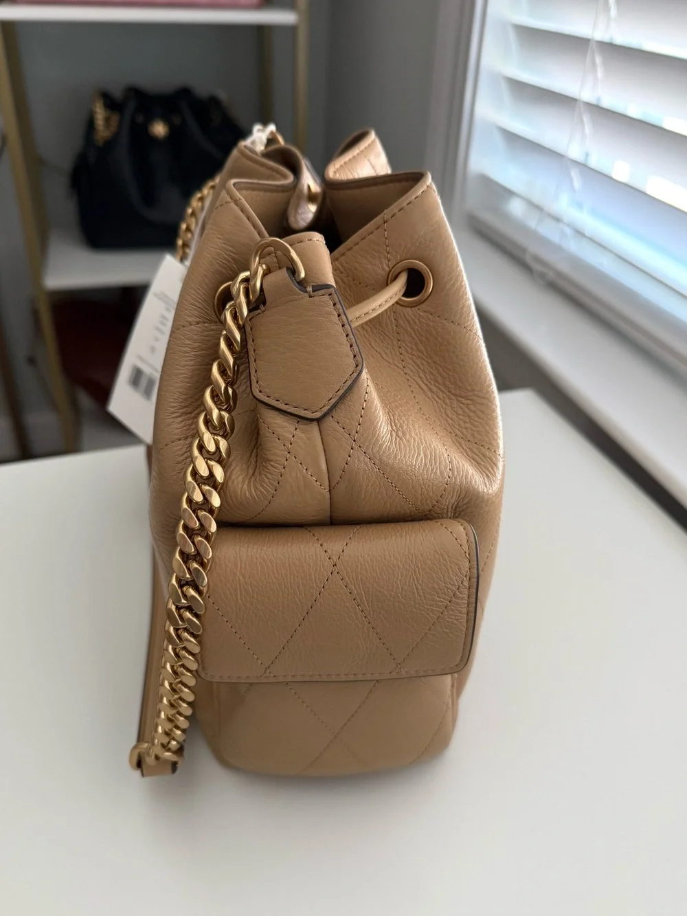 Tory Burch but bag brand