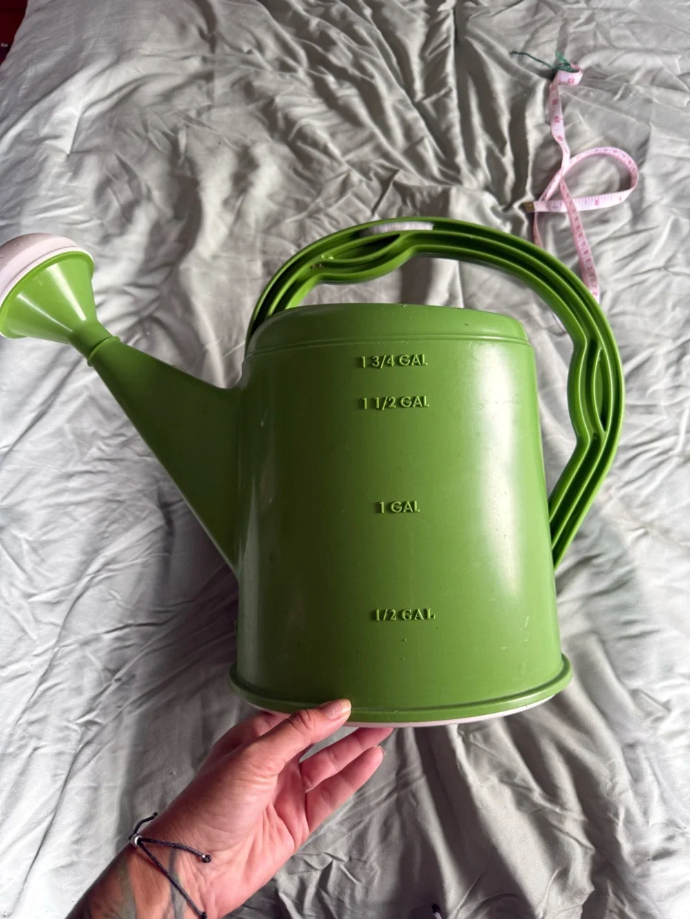 Green Plastic Watering Can with Measurement Markings