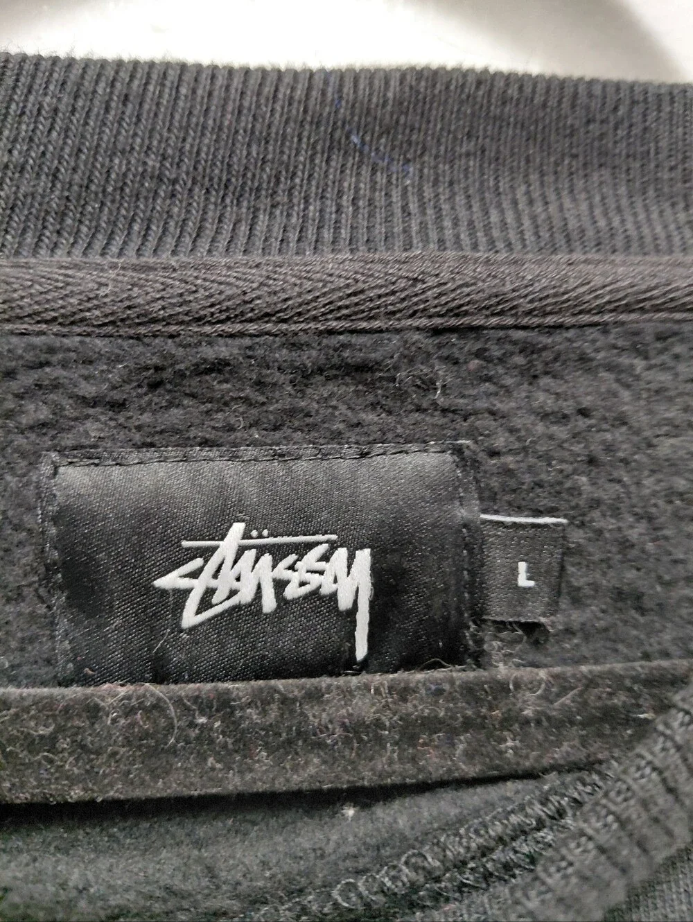 Stussy label signature