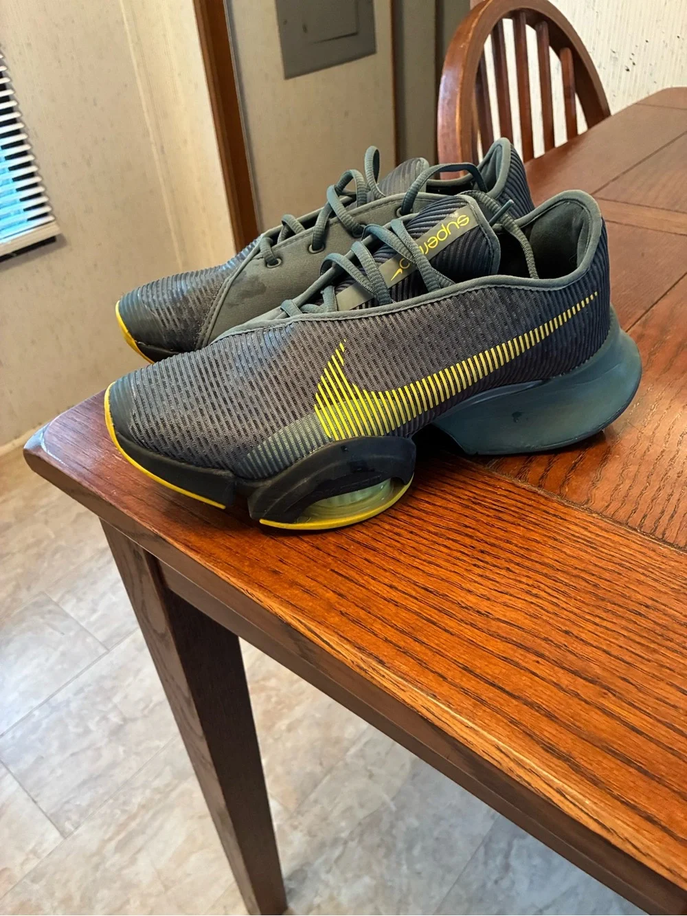 Nike Men’s Gray Athletic Shoes with Yellow Swoosh