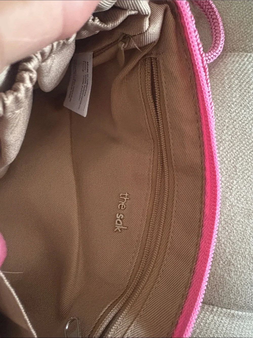 The Sak zipper closure hardware