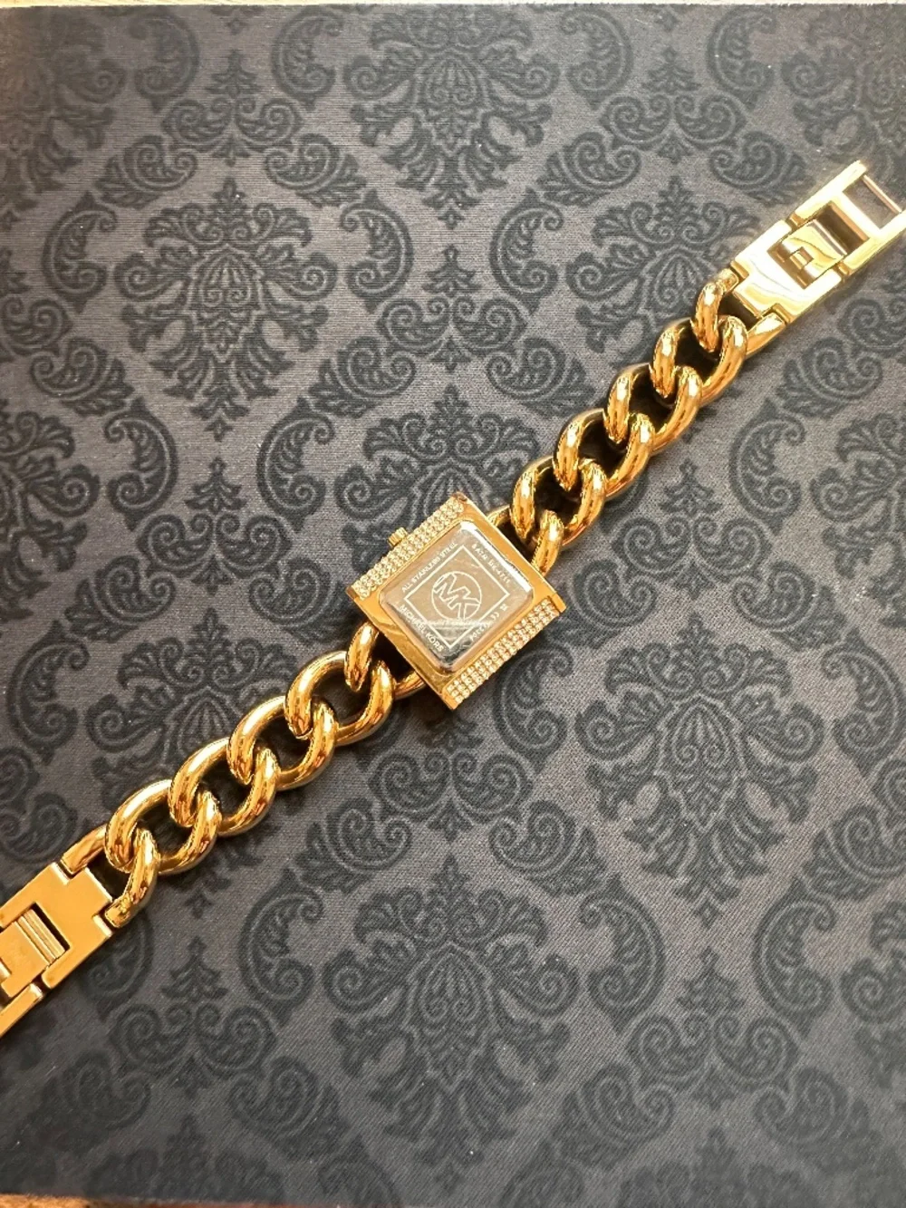 Michael Kors striking along