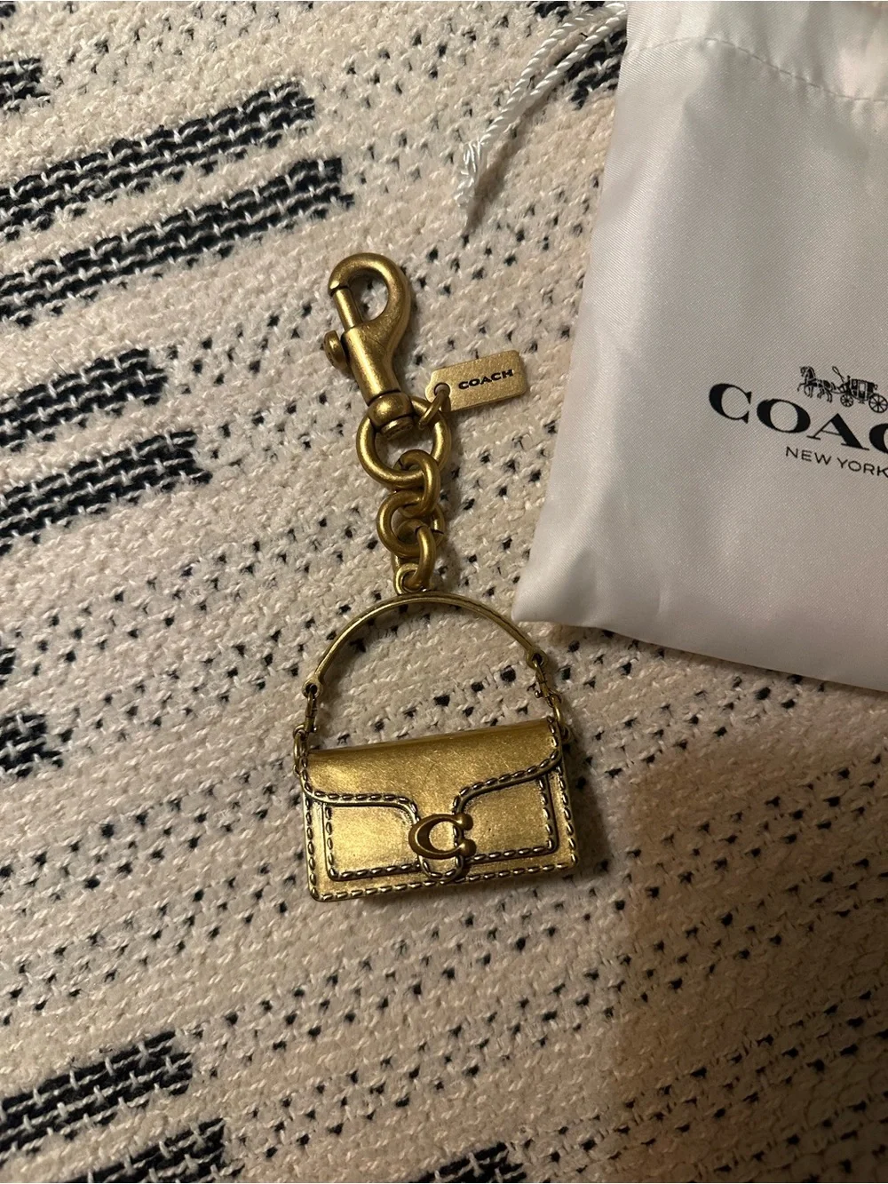 Coach gold tone