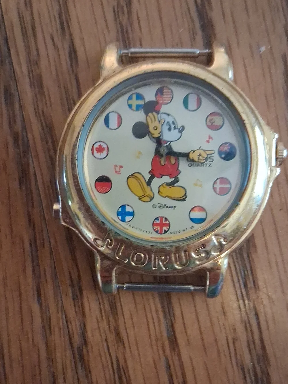 Vintage Disney Gold Tone Mickey Mouse Dial Watch with Multicolor Flag Accents