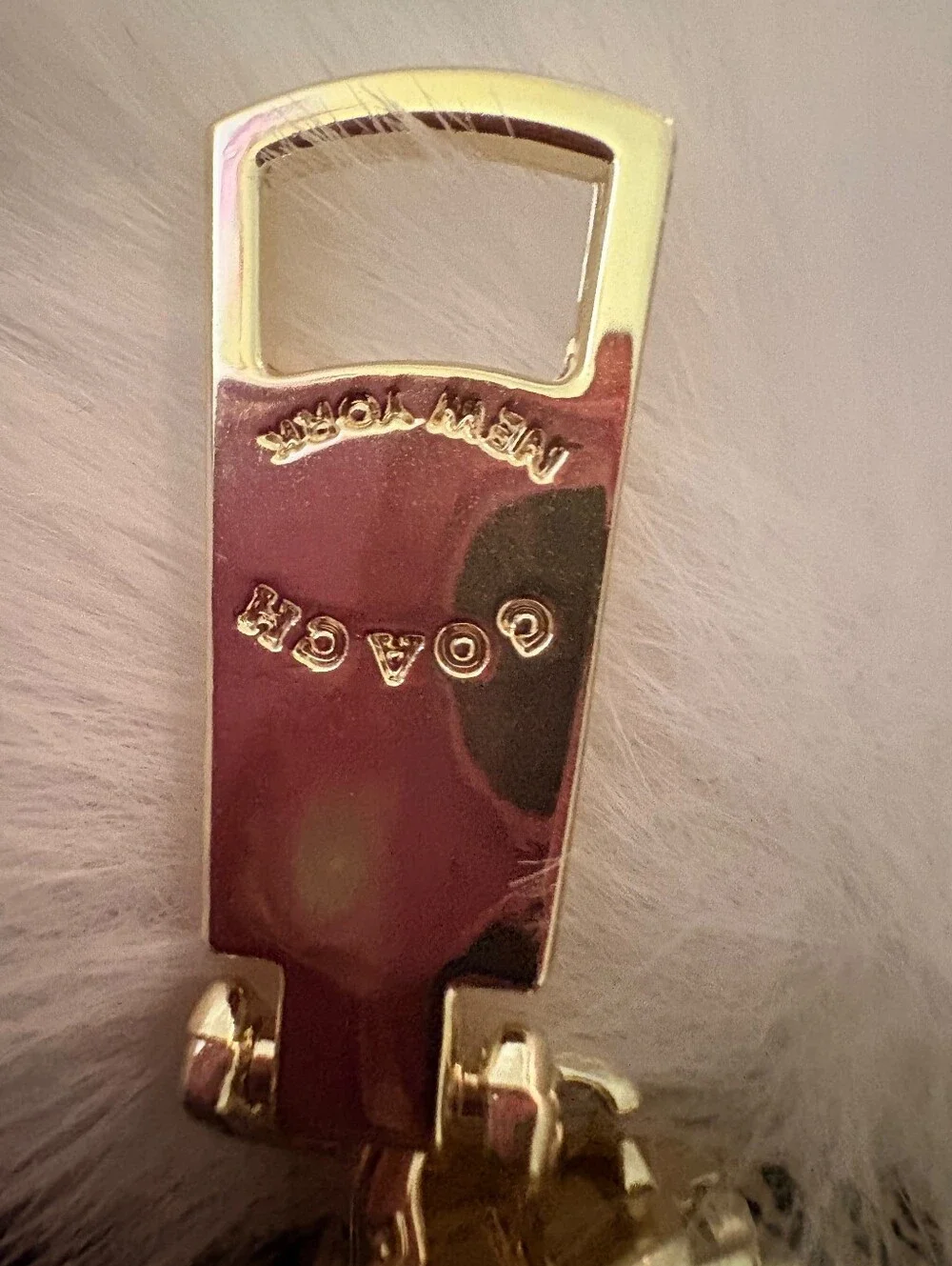 Coach gold tone