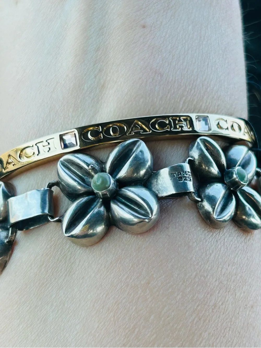 Coach sleek gold