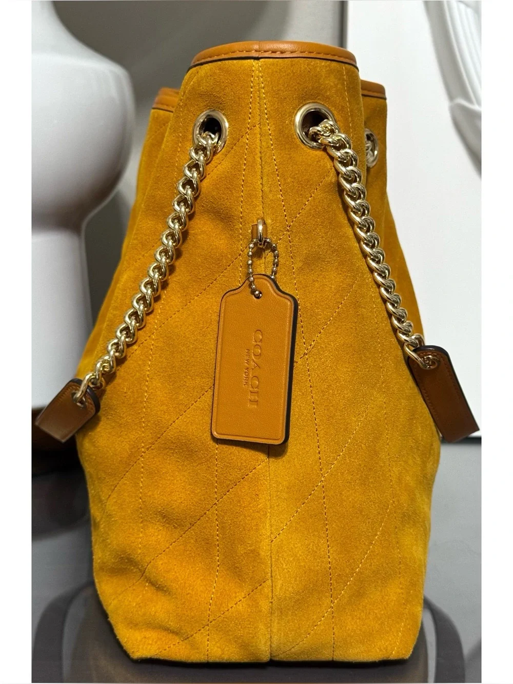 Coach features charm